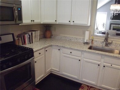 Stainless steel appliances and gorgeous Quartz cou