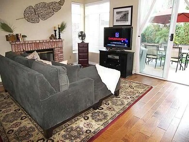 Family room with beautiful hardwood flooring.