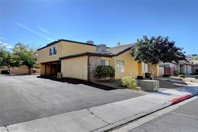 View of front of property with brick siding and stucco siding