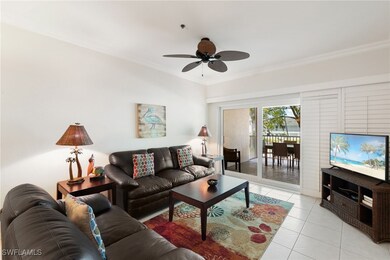 Living area with ornamental molding, ceiling fan,