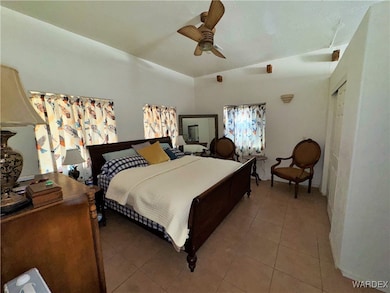 Bedroom with light tile patterned floors, a ceilin