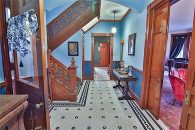 Spacious Foyer with penny tile floor