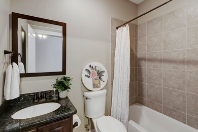 En-Suite bath offers granite countertops, vanity b