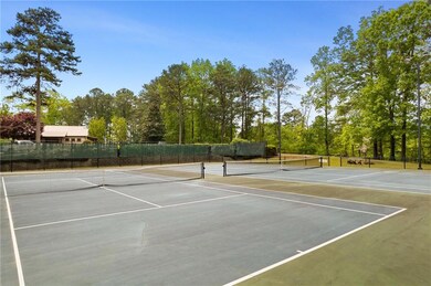 View of tennis court featuring community basketbal