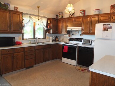 Kitchen is has lots of cabinet space, a pantry and