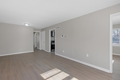 Unfurnished room with light hardwood / wood-style 
