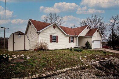 Great newly painted shed to store many items at the side of the home!