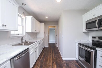 Kitchen has plenty of counter space. New stainless appliances.