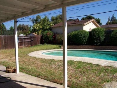 Covered patio along back of home