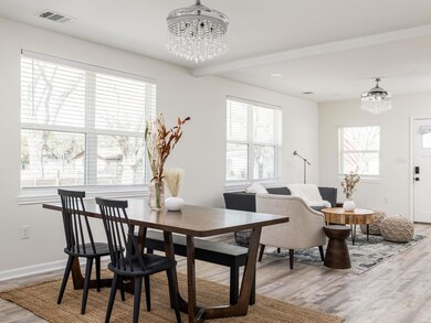 Dining space with a notable chandelier, baseboard