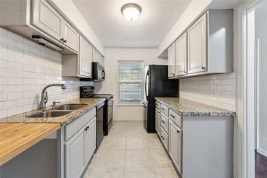 The kitchen is light and bright, and the matching