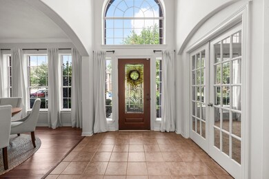 The entry space is accented by elegant archways an
