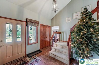 The Foyer features a vaulted ceiling, a large coat