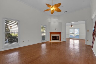 Unfurnished living room with a towering ceiling, o