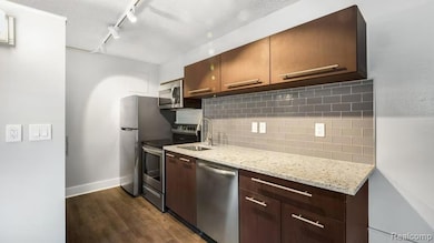 1050 N Adams Rd unit 114, Birmingham, MI 48009 - photo 2