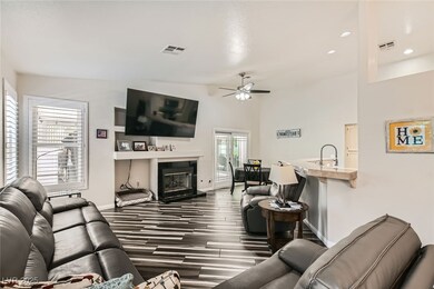 Family Room Features a Gas Fireplace and Vaulted C