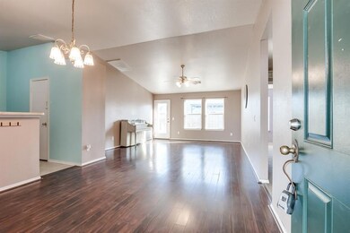 Foyer entrance with baseboards, wood finished floo