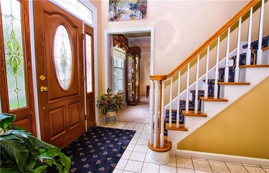 New fiberglass front door opens into the 2 story f