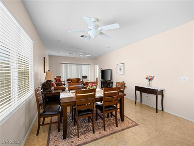 Dining space featuring light tile patterned floors