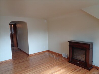 Living room beautiful hard wood floors and electri