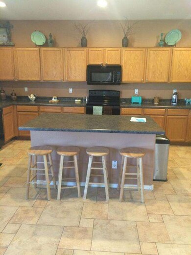 Kitchen island and loads of cabinets