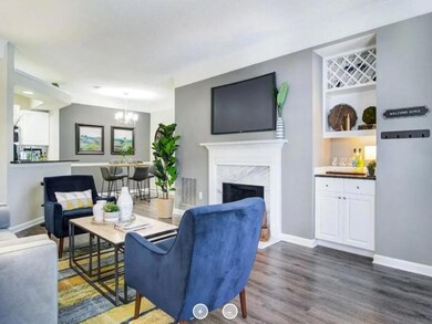 Living room featuring dark wood-type flooring, a n