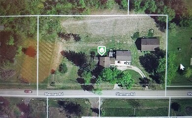 overhead of the property - House and 3 car attache