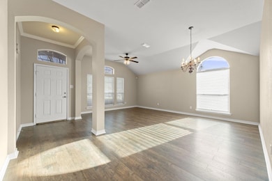 Foyer entrance with dark wood-type flooring, ceili