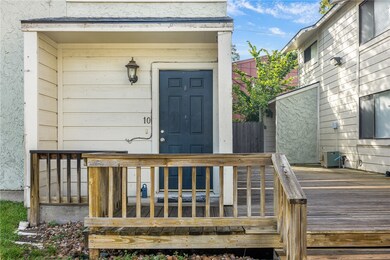 Doorway to property with a wooden deck