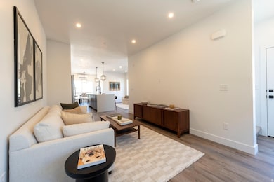 Living area featuring recessed lighting and wood finished floors