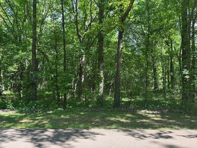 View of landscape featuring a wooded view