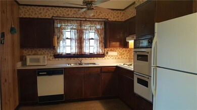 Kitchen with breakfast area at other end of room