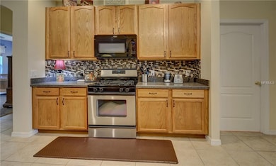 Gas stove. Indoor utility room with sink and garag