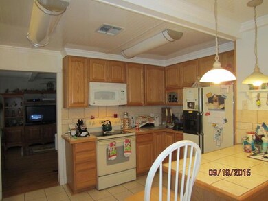 Kitchen with lovely oak cabinets, tile flooring an