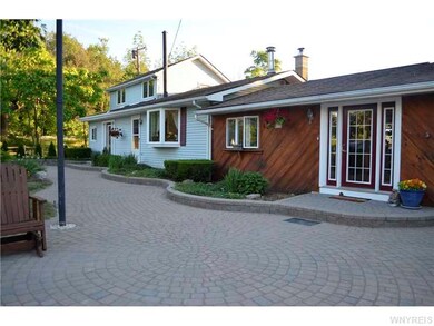 Exterior Front. Notice the custom pavers