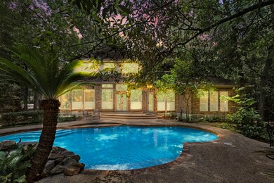 Stunning view of pool at night