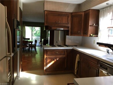 View of kitchen from the garage door looking into 