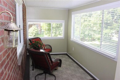 Enjoy morning coffee in the enclosed 3 season fron