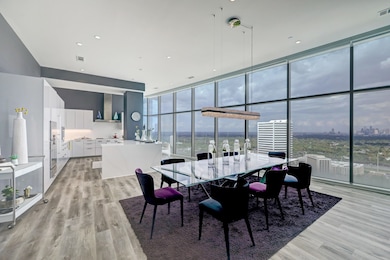 The wall of huge windows stretches the length of t