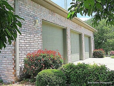 Exterior Front. Oversized 3 car garage, Side Entry