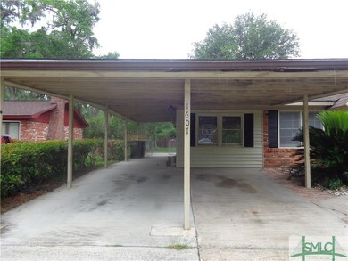 Carport with gate to backyard