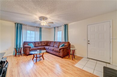 Front door entrance into living room.  Light and b