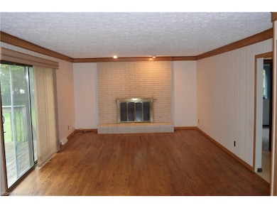 Large family room with brick wood-burning fireplac