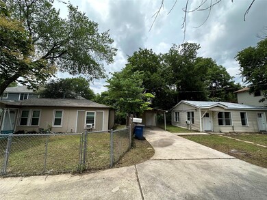 View of front facade with driveway and cooling un