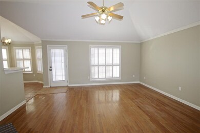 The great room offers a French door leading to the