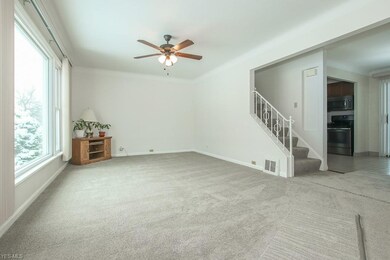 Freshly painted living room with brand new carpet.