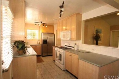 Bright kitchen open to living and dining areas