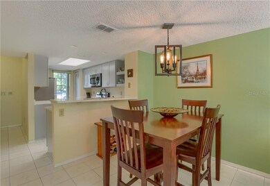 View of the dining room with the kitchen in the ba