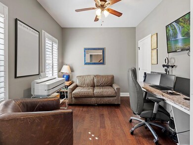 Office featuring dark wood-style floors, baseboard