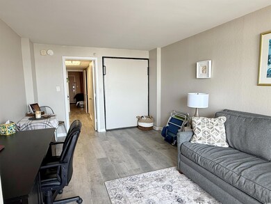 Living room featuring a desk and wood finished floors